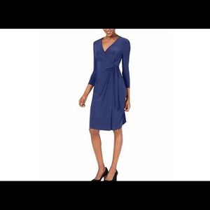 Formal navy blue faux wrap sheath dress, stops just below knee